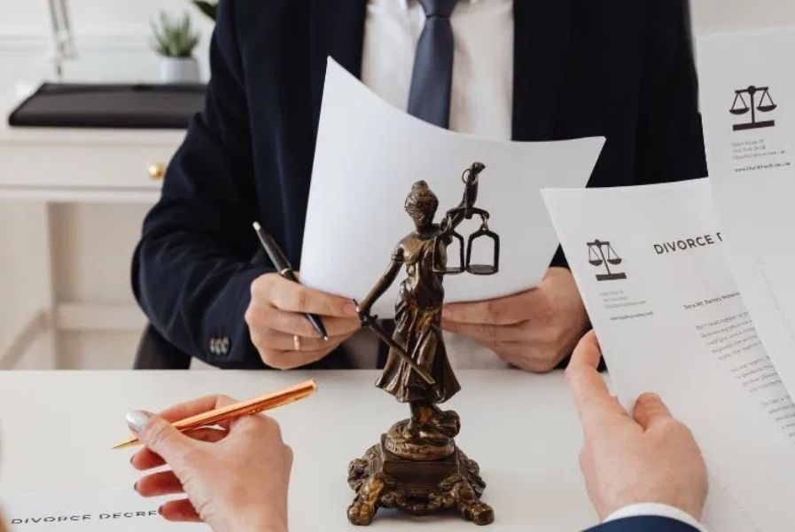 Collaborative divorce lawyer reviewing decree with client during consultation.