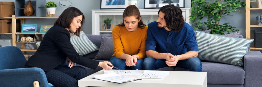Couple discussing divorce mediation in Kansas with a professional.
