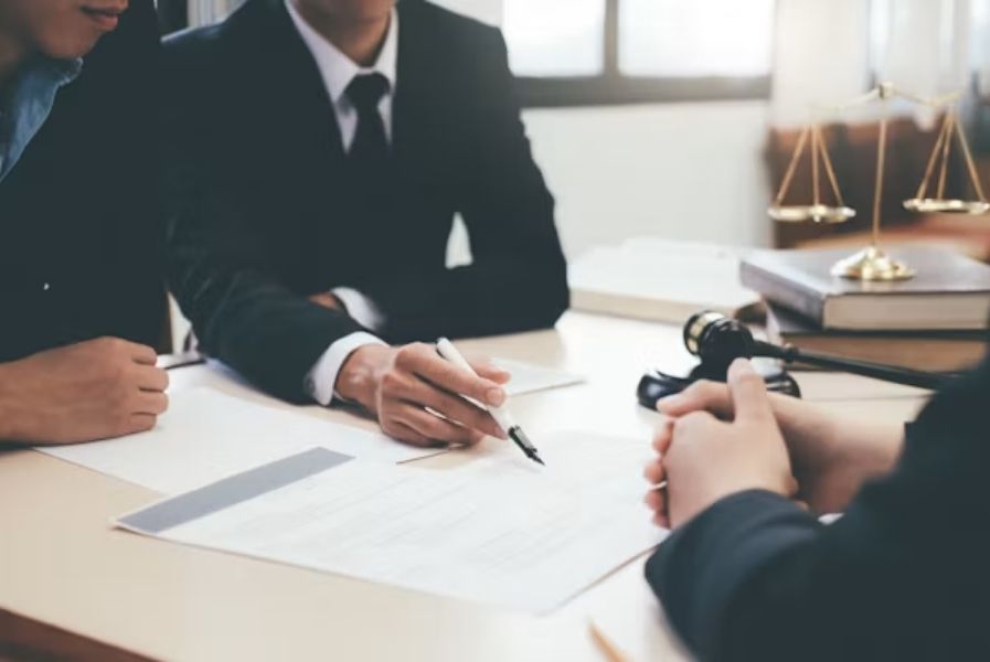 Divorce attorney in Overland Park reviewing divorce documents with a client.