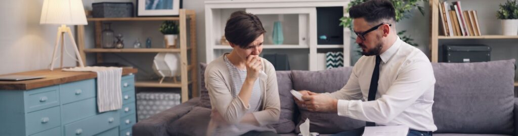 Divorce lawyer in Kansas discussing a family law case with a client.