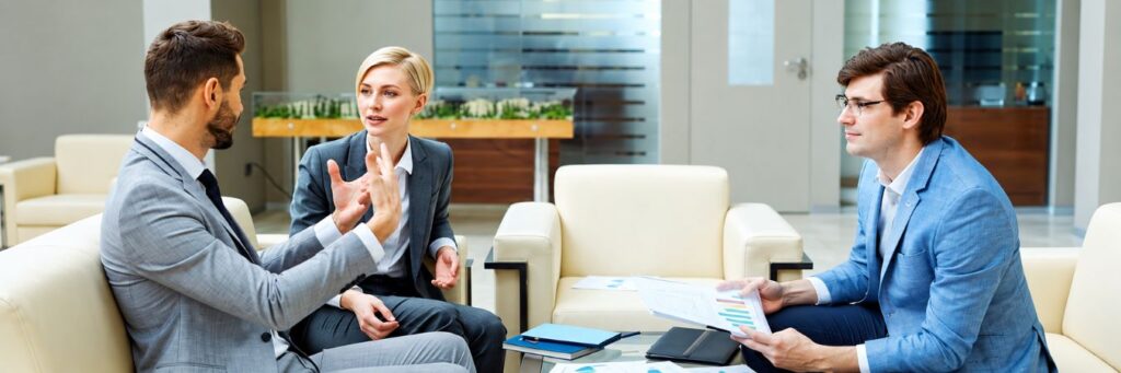 Business professionals discuss legal matters during divorce mediation in Kansas